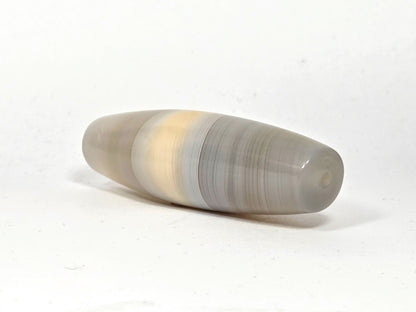 N-N-062126-1E angled end view, natural banding wraps tip