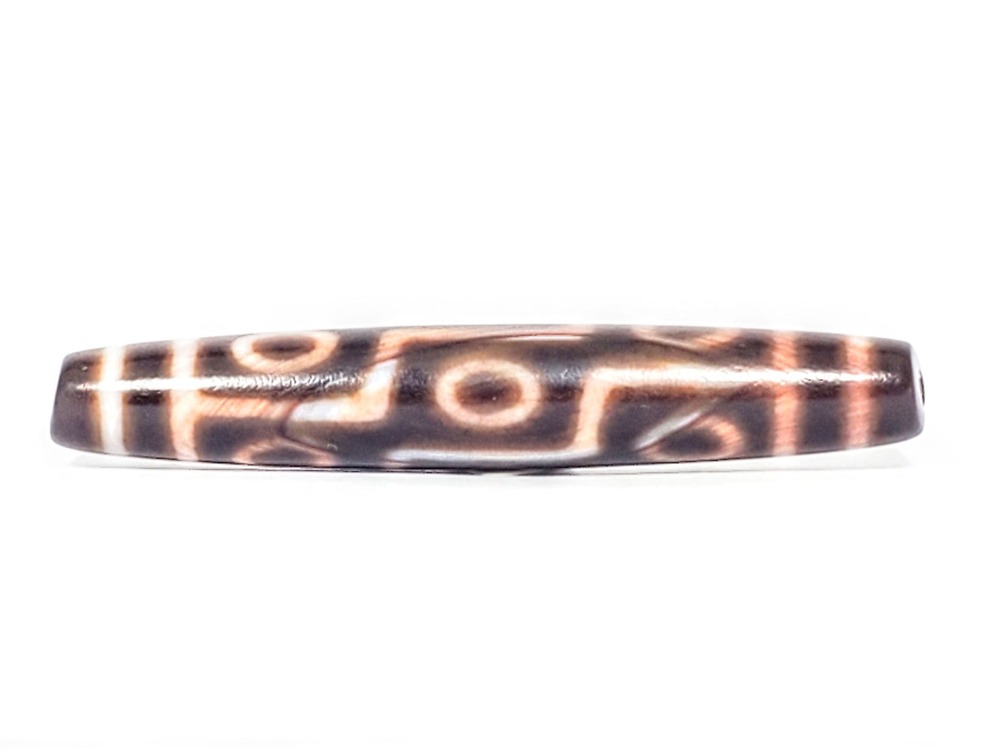 At-062926-9EBS face A, 77.0×12.8mm deep dark brown antique nine eye dzi, warm cream-peach motif lines, unretouched