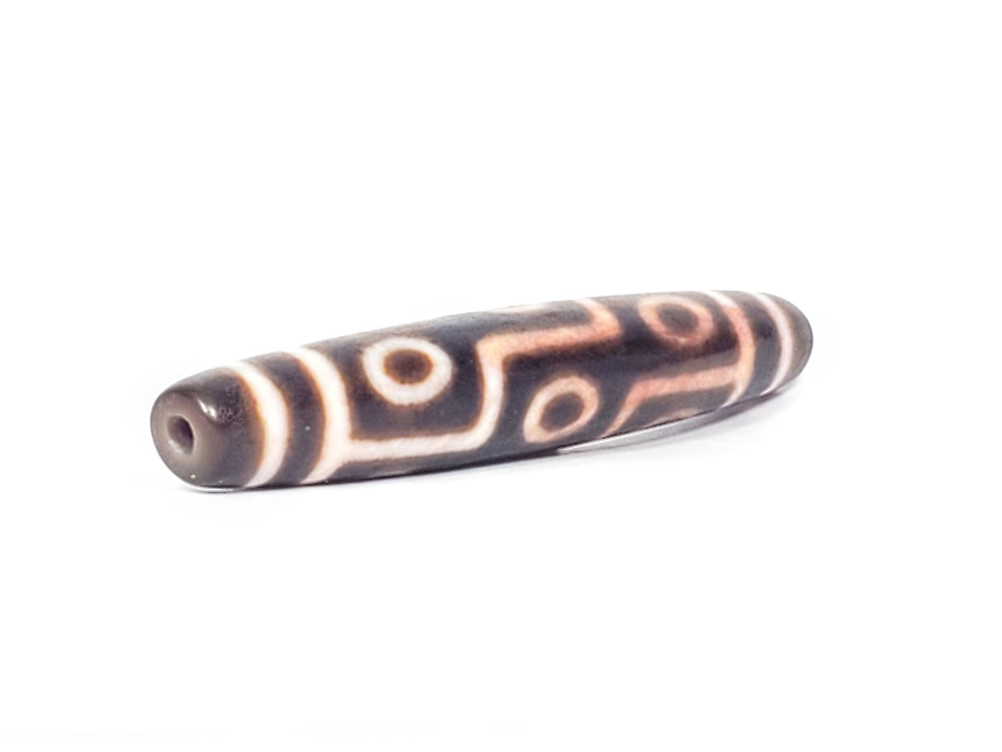 At-062926-9EBS angled view opposite end, 77.0mm nine eye dzi, drill hole visible, deep dark brown agate, unretouched