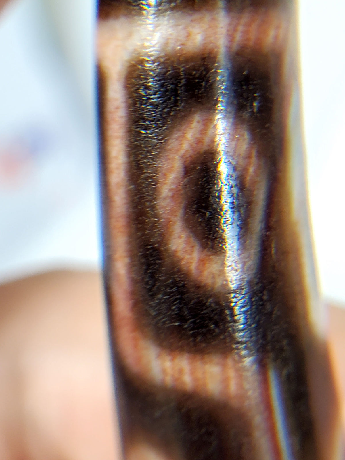 At-062926-9EBS face C, deep dark brown agate nine eye dzi, third rotation, crisp motif lines, unretouched