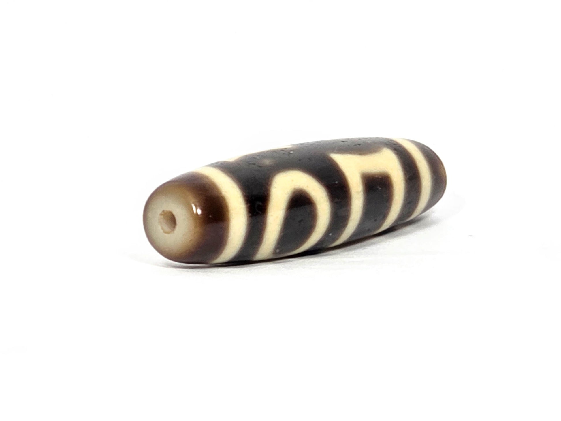 N-062926-DHE drill-end second angle, honey-brown surround, standard hole, double heaven earth dzi, unretouched