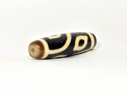 N-090225-4E2 drill-end second angle, dark brown end zone, curve line wraps toward hole, unretouched