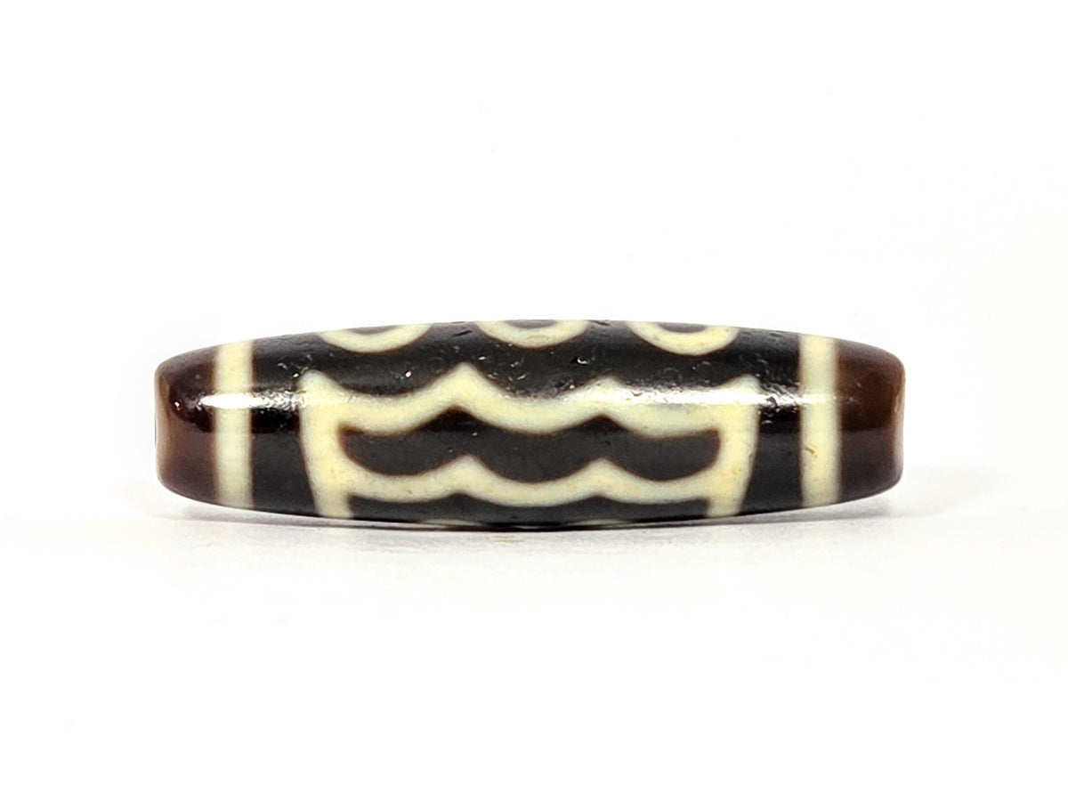 Five-eye dzi bead, dark brown agate, white wave & eye motifs, elongated oval shape, smooth polished surface, 41mm