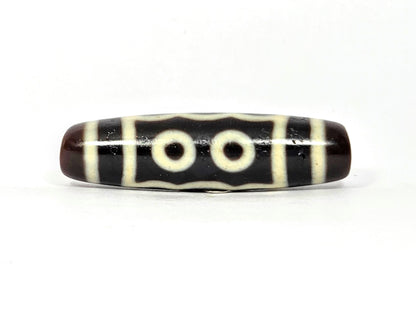 N-091125-5E2 two-eye face, two cream-white eye rings, very dark brown agate dzi, unretouched