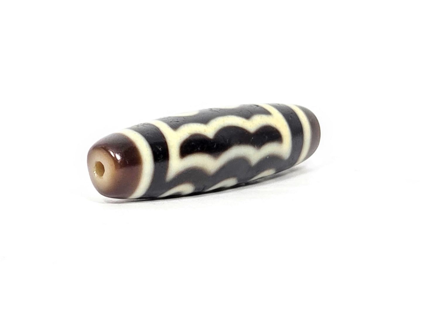 N-091125-5E2 drill-end second angle, honey-brown surround, standard drilling, very dark brown agate dzi, unretouched