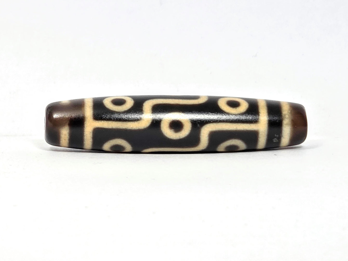 N-122225-9E Nine Eye dzi bead, rotated view showing full nine eye sequence, unretouched