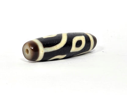 N-082825-4E drill-end second angle, dark brown end zone, curve line wraps toward hole, unretouched