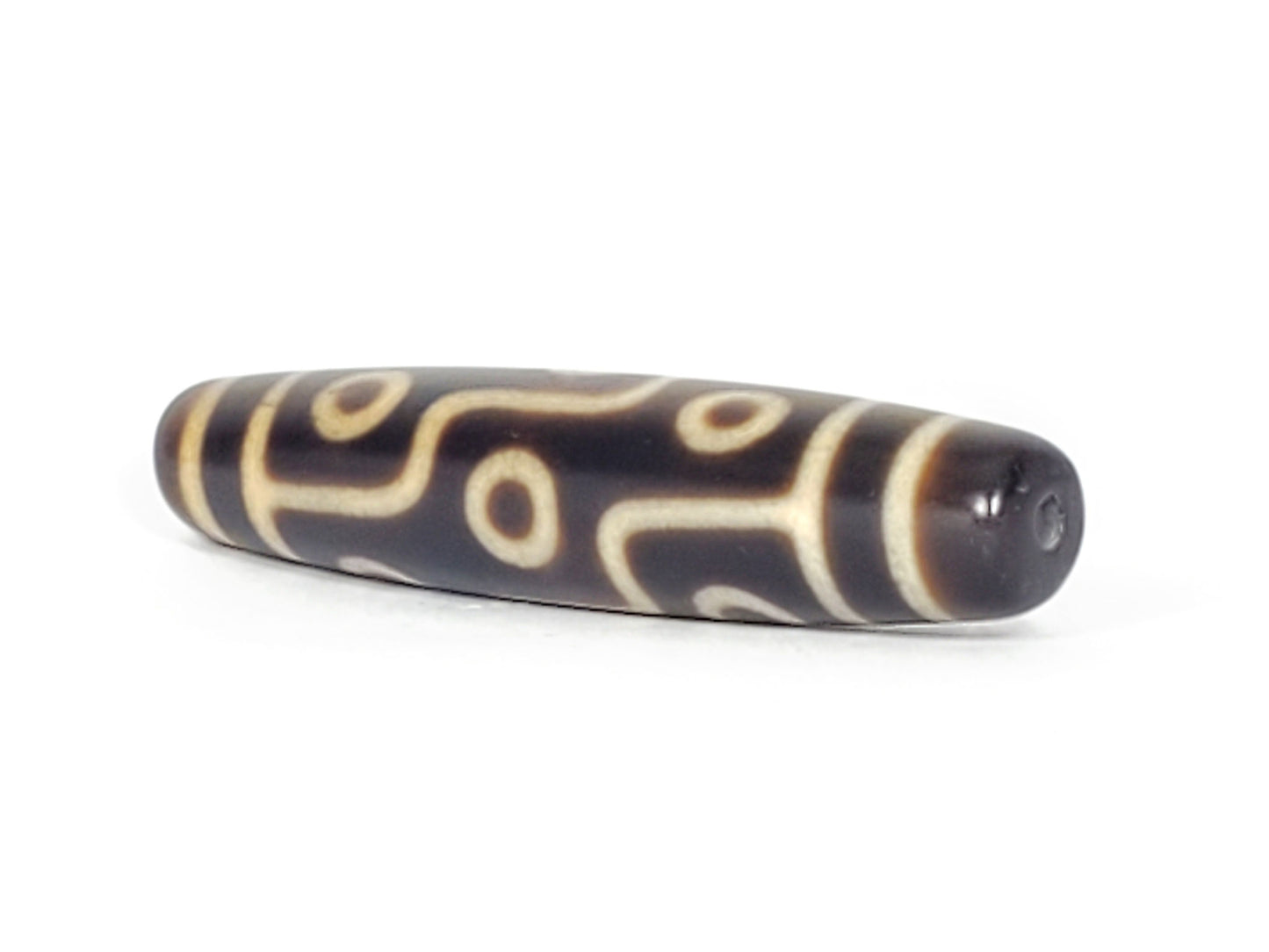 N-041424-9E Nine Eye dzi bead, angled end view showing drill hole, dark brown agate, unretouched
