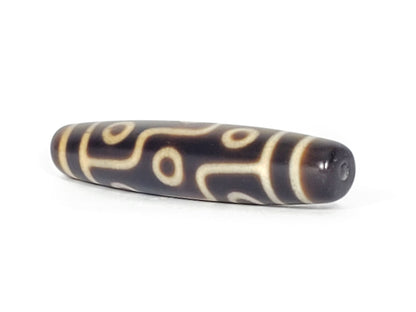 N-041424-9E Nine Eye dzi bead, angled end view showing drill hole, dark brown agate, unretouched