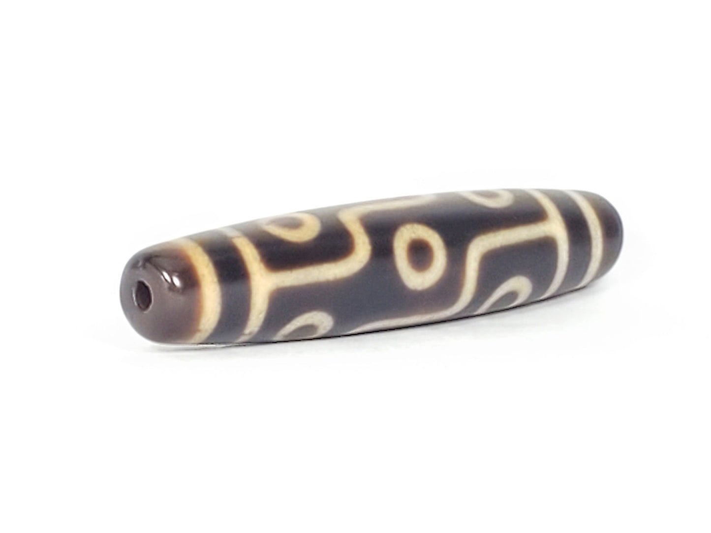 N-041424-9E Nine Eye dzi bead, opposite end angled view, drill channel visible, unretouched