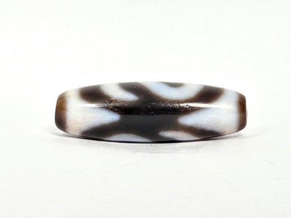 N-070526-MHkBS rotated face 4, money hook dzi, top-edge view, dark brown, X-form motif, surface marks visible, unretouched