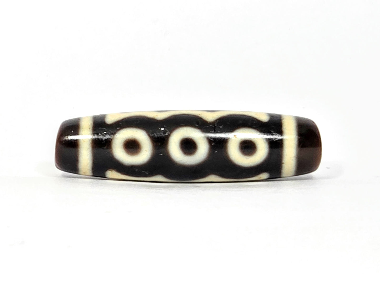 N-091025-5E three-eye face, three cream-white eye rings in row, very dark brown agate dzi, unretouched