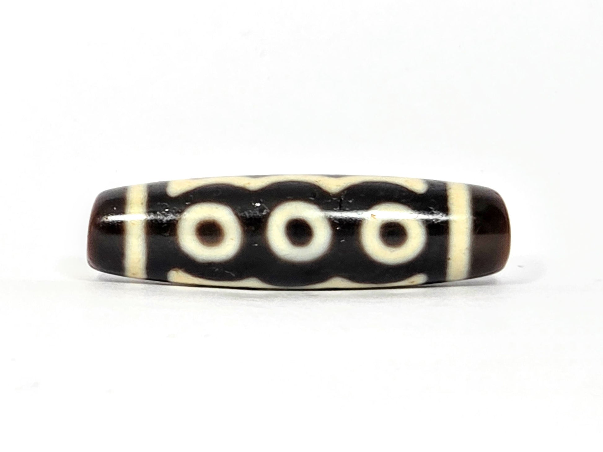 N-091025-5E three-eye face, three cream-white eye rings in row, very dark brown agate dzi, unretouched