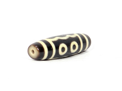N-091025-5E drill-end second angle, honey-brown surround, three-eye face visible, standard drilling, unretouched
