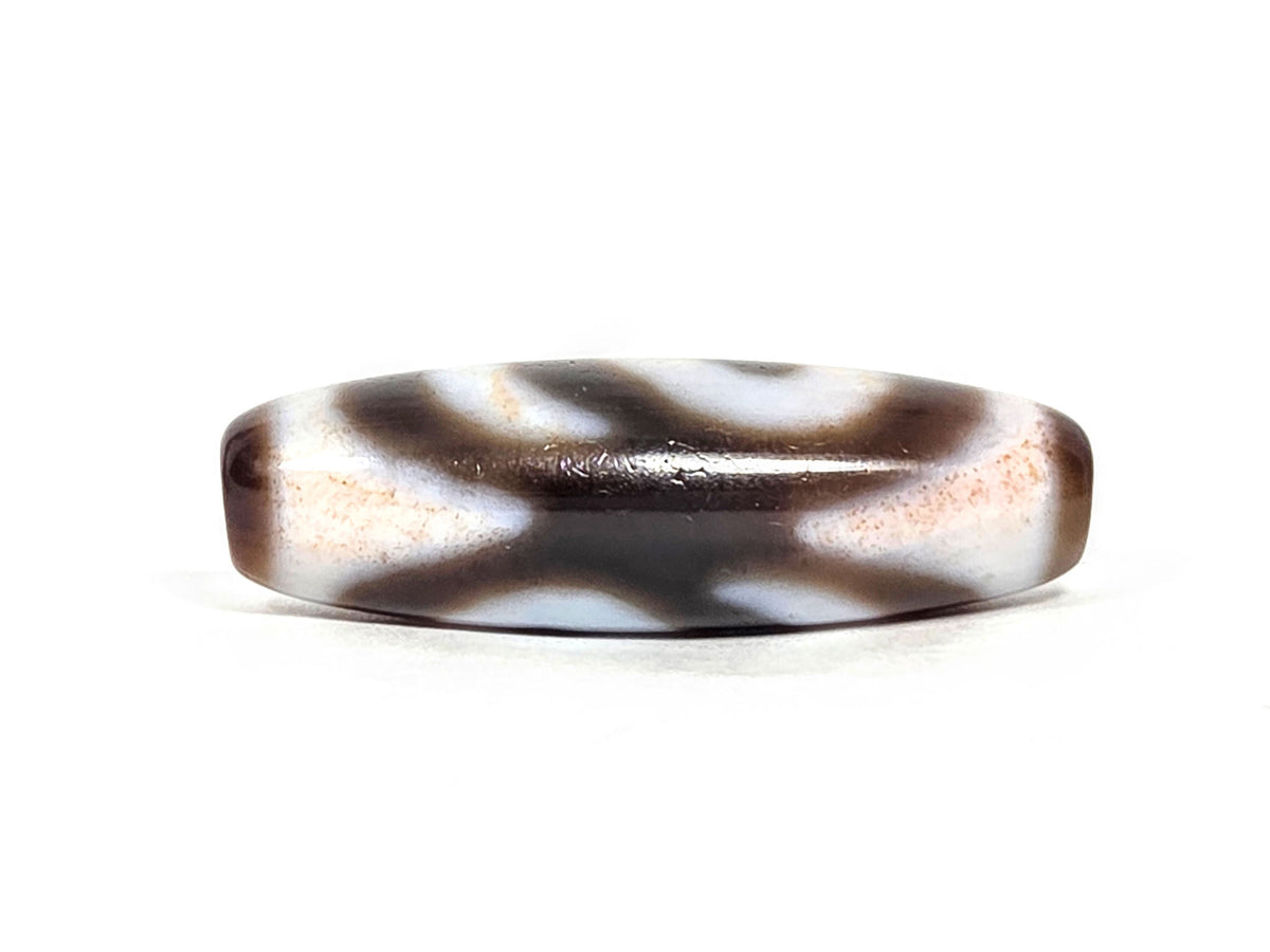N-070526-MHkBS rotated face 2, money hook dzi, very dark brown ground, open wing-form motif reading, unretouched