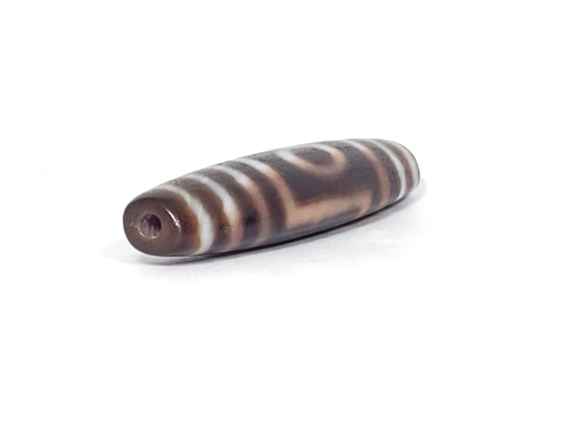 Ancient one eye mountain dzi — angled view, drill hole at narrow tip, brown cream stripes and bloodspots, Anc-0426-1EMt