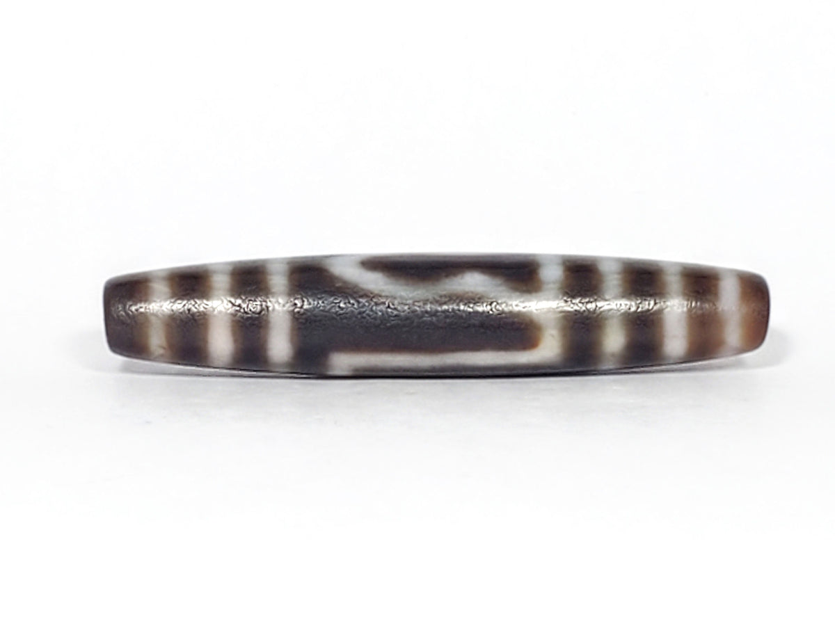 Ancient one eye mountain dzi — opposite side, dark brown ground, deep patina and age wear visible, Anc-0426-1EMt