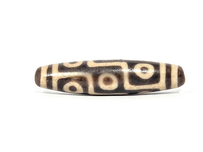 Ac-032326-9E5 Face A rotated, nine-eye meander composition showing different eye positions, warm brown agate, unretouche