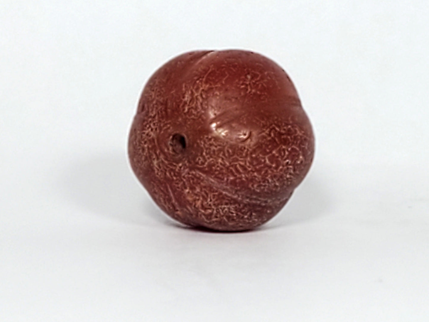 Ac-061126-PKP Bead A drill hole face, small off-centre bore, surface crazing radiating from hole, unretouched