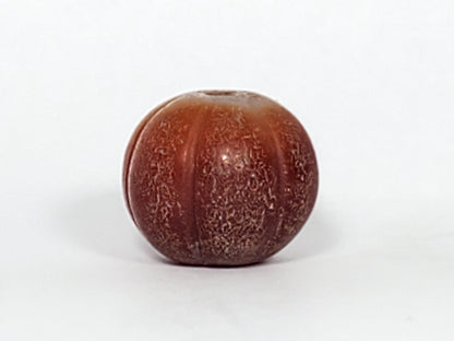 Ac-061126-PKP Bead B second face, natural banding visible in rib alignment, crackle in lobe valleys, unretouched
