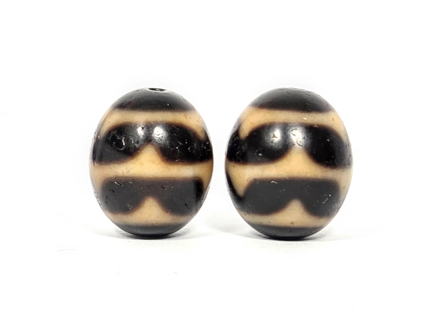 Pair of round Double Wave Dzi beads showing wave pattern etching on natural agate — Taiwan 1980s vintage