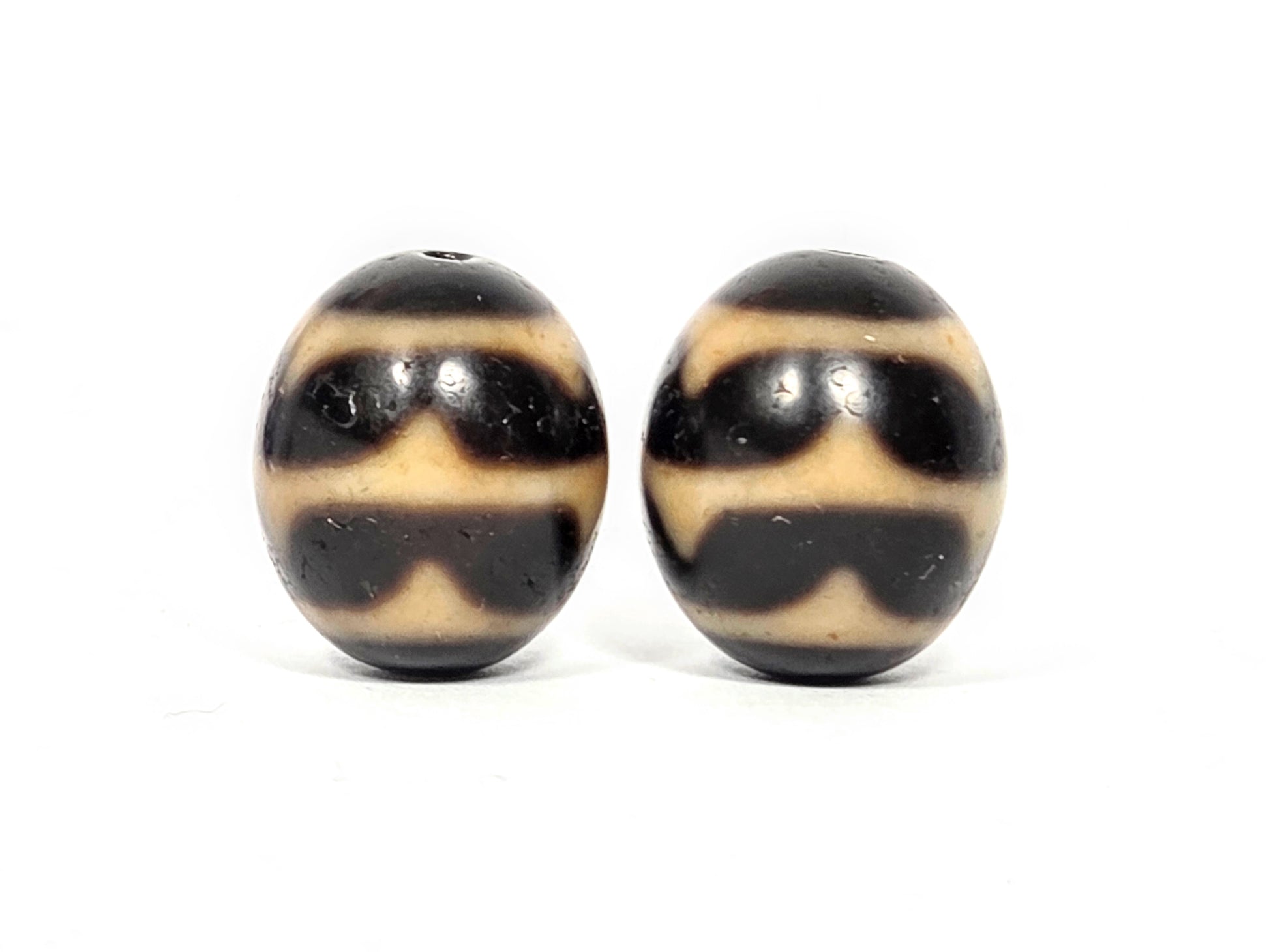Pair of round Double Wave Dzi beads showing wave pattern etching on natural agate — Taiwan 1980s vintage