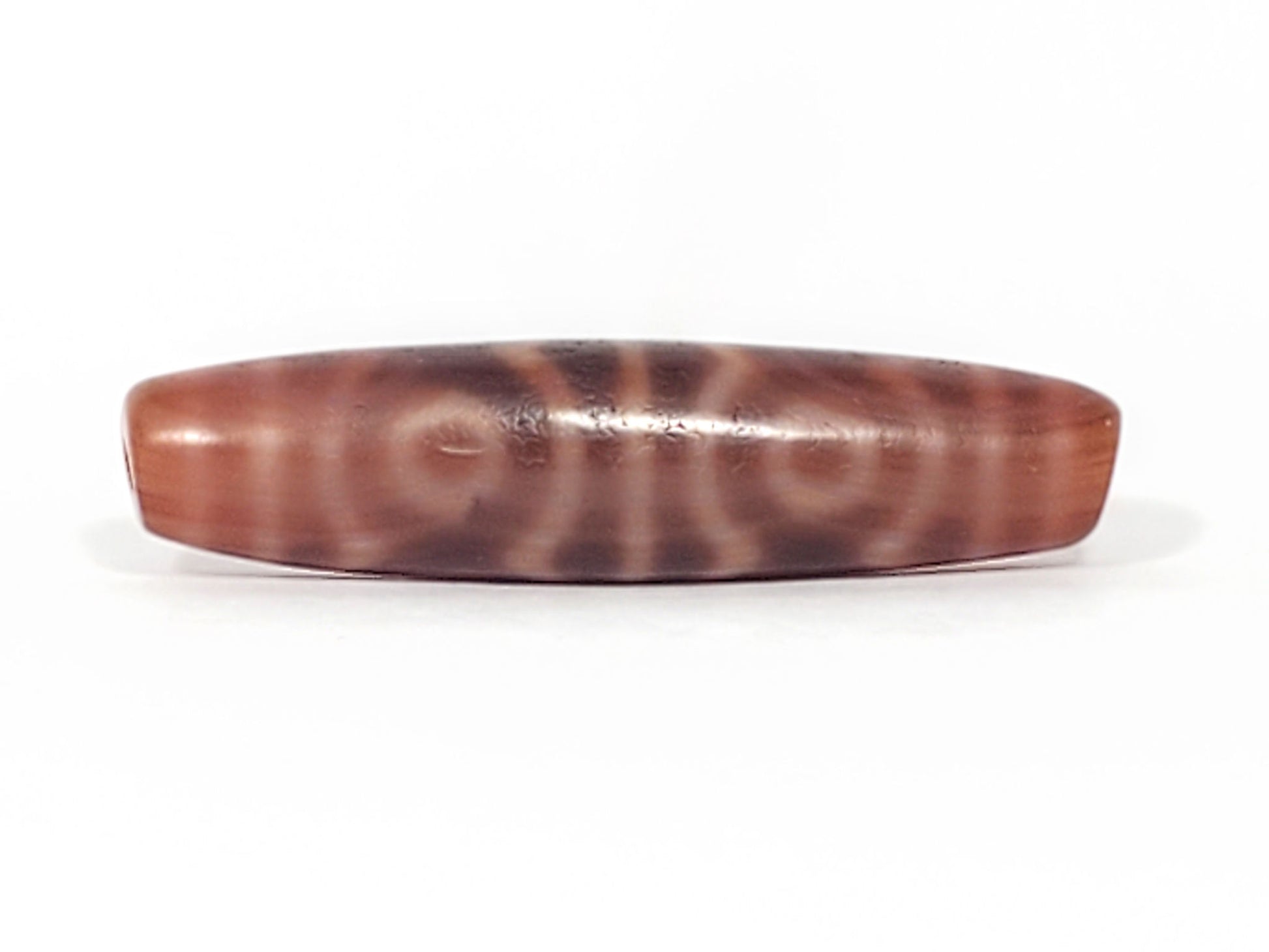 At-082624-6EBS, Face C with two closed eyes, warm beige-cream rings, matte aged surface texture, unretouched