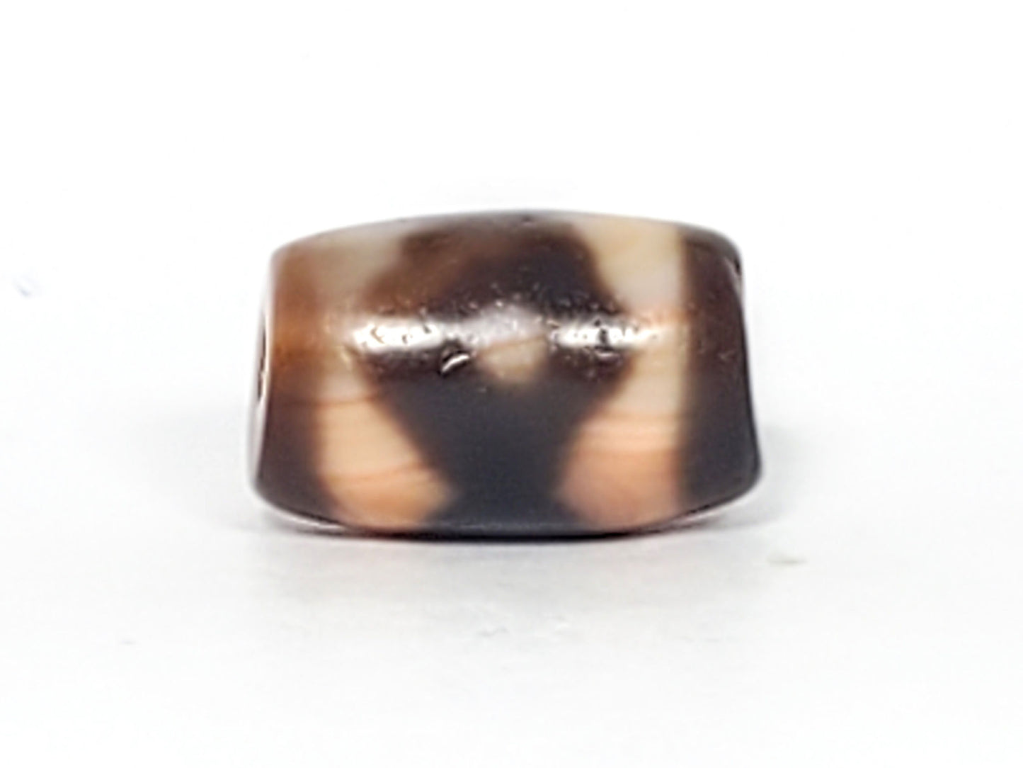 At-061926-3E2 Face A, warm peach-cream ground, dark brown motif form, 16.7×10.8mm, unretouched