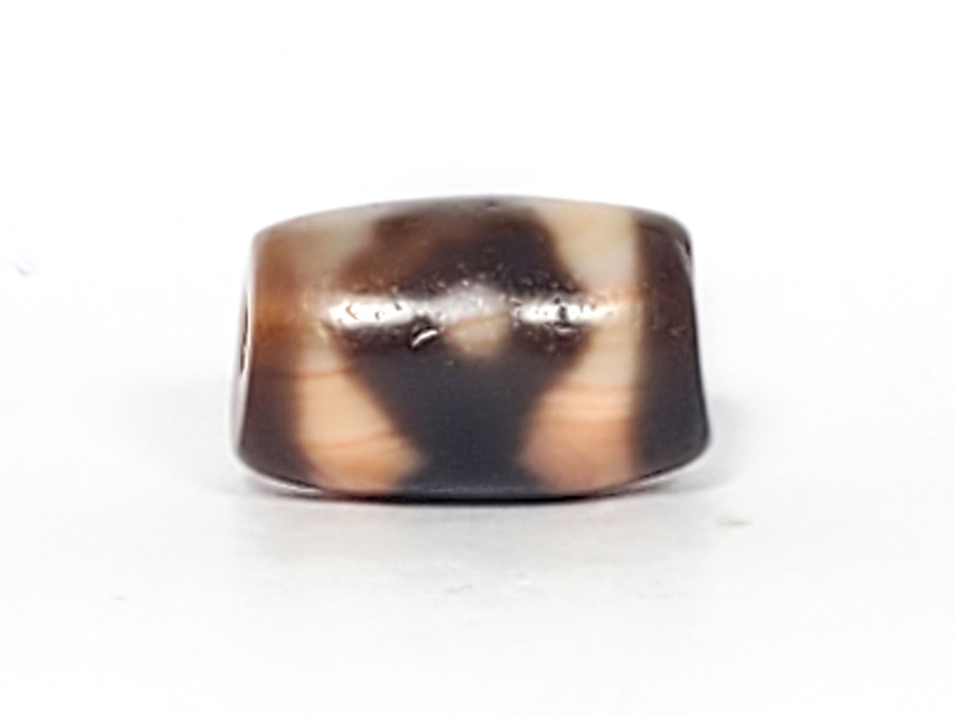 At-061926-3E2 Face A, warm peach-cream ground, dark brown motif form, 16.7×10.8mm, unretouched