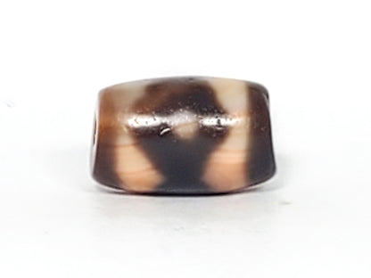 At-061926-3E2 Face A, warm peach-cream ground, dark brown motif form, 16.7×10.8mm, unretouched