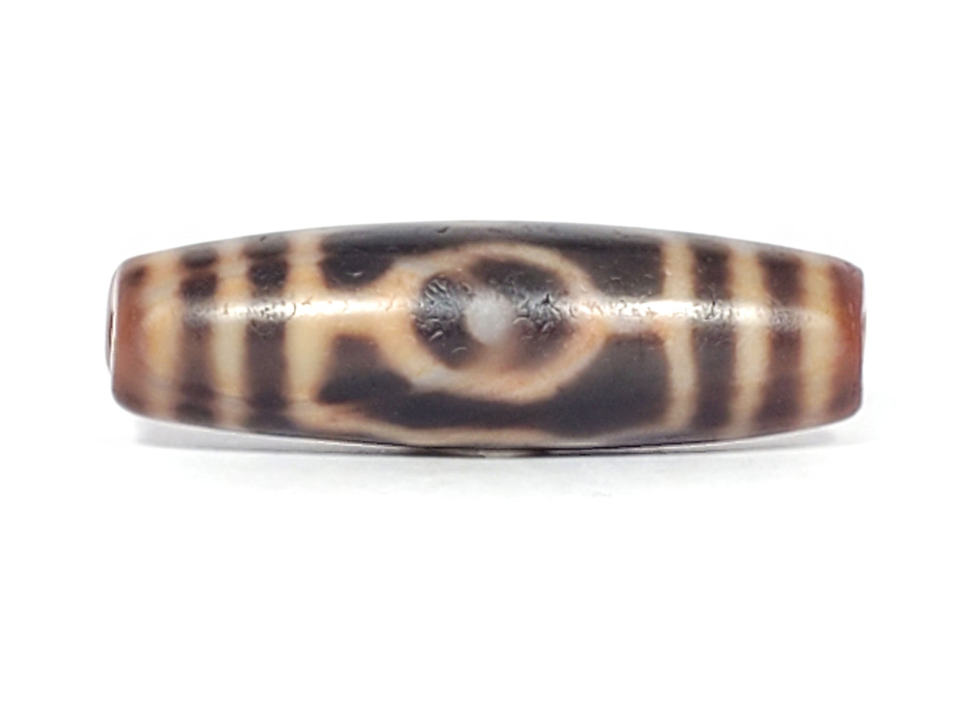 At-061926-3EEG Face A, closed ring eye, white pupil highlight, warm dark brown agate, unretouched
