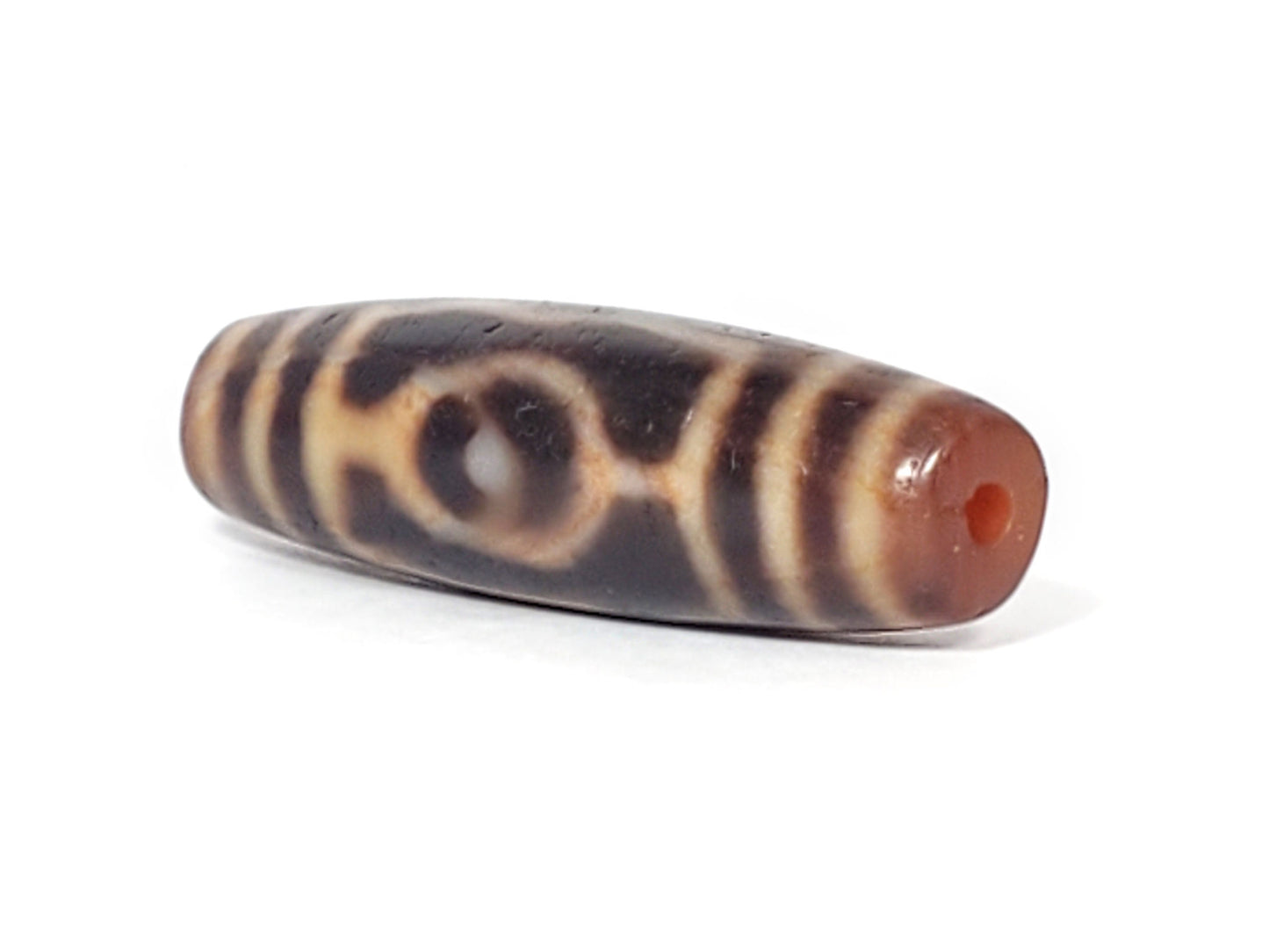 At-061926-3EEG angled tip A, vivid orange-red drill interior, terracotta end cap, unretouched