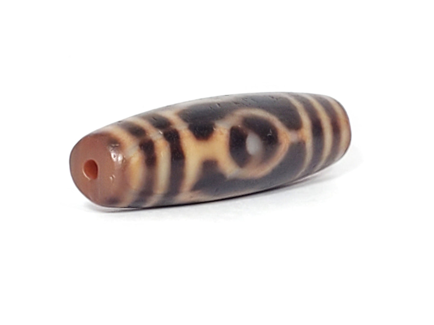 At-061926-3EEG angled tip B, linked ring motif visible, terracotta end cap, unretouched
