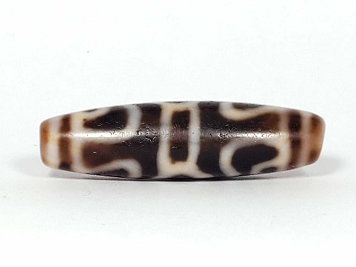 Ac-061926-GRDC Face D, abstract scroll and bracket elements, deep dark chocolate-brown ground, unretouched