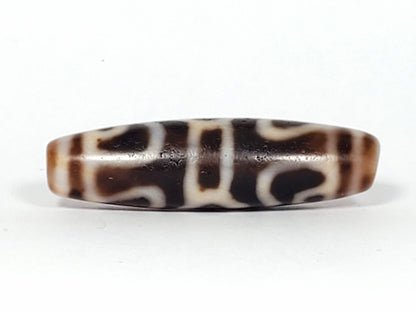 Ac-061926-GRDC Face D, abstract scroll and bracket elements, deep dark chocolate-brown ground, unretouched