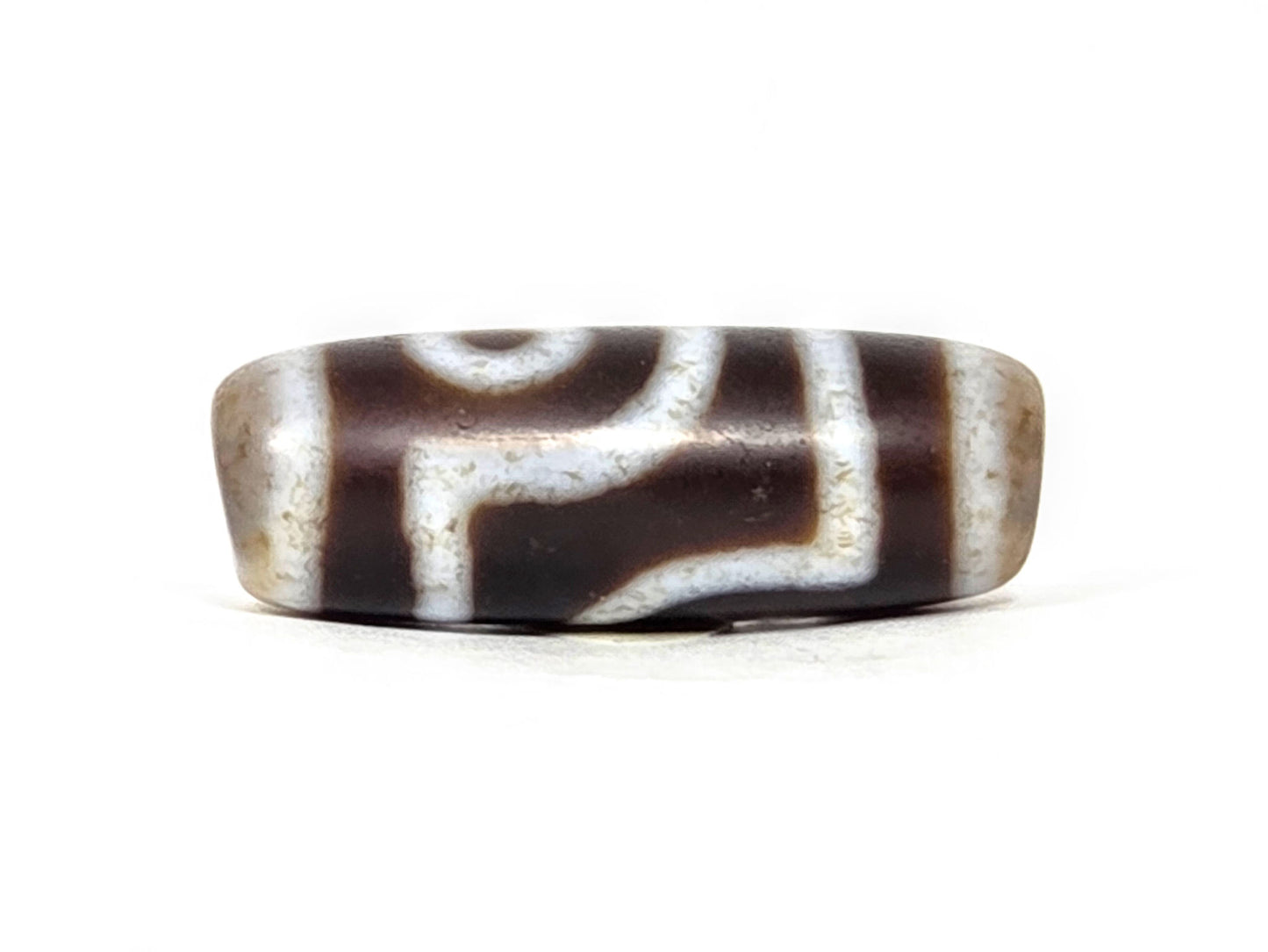 V-062126-2E dzi bead, straight side profile, eye and bar divider visible, unretouched