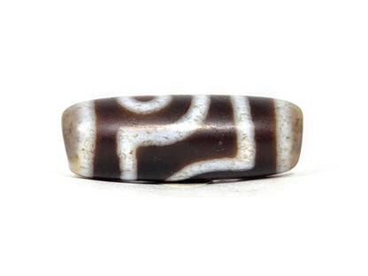V-062126-2E dzi bead, straight side profile, eye and bar divider visible, unretouched