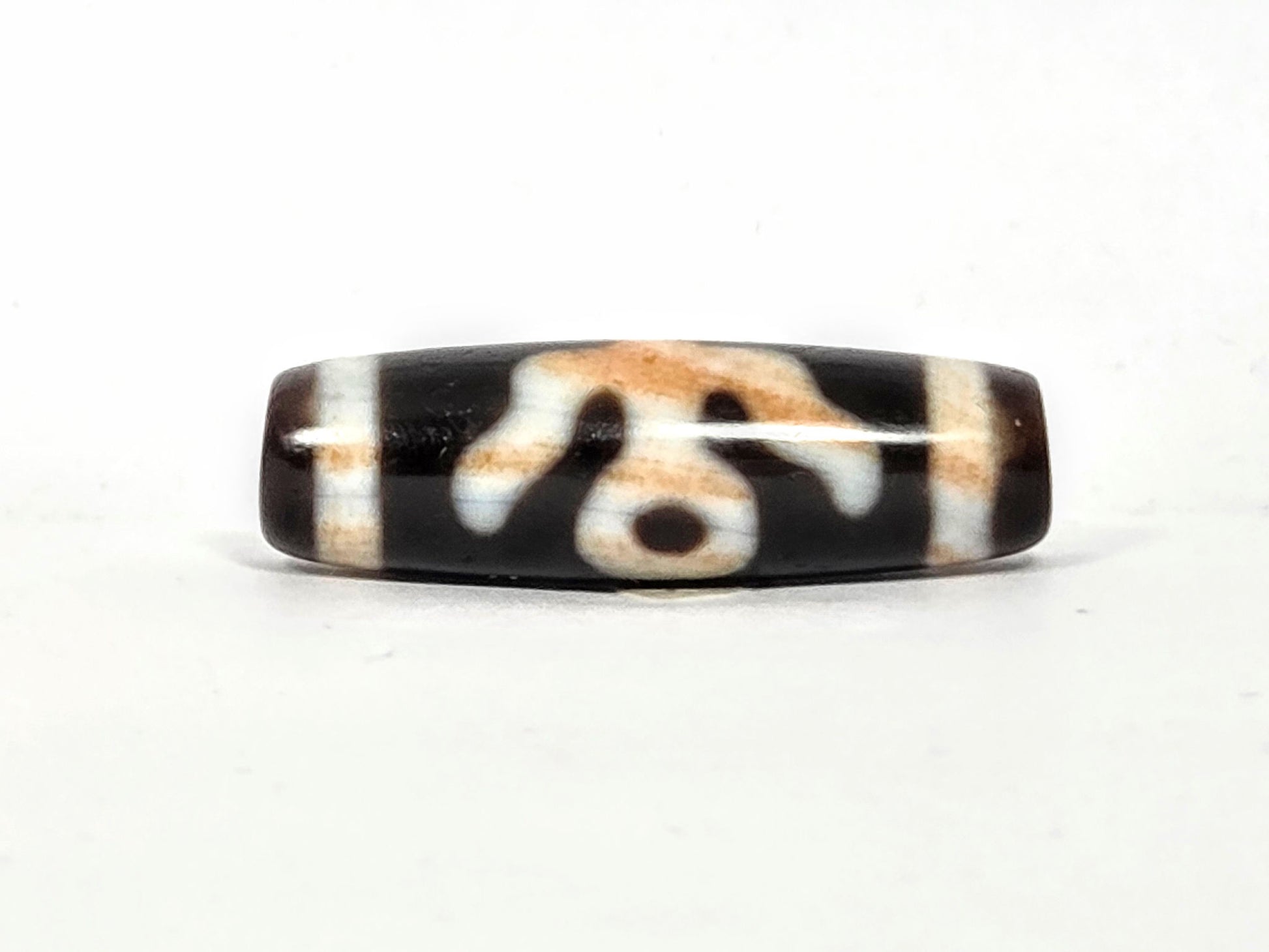 V-021326-BenBS vintage Benefactor dzi bead, third face rotated 180°, open arcs and lower dot, dark brown ground, unretouched.