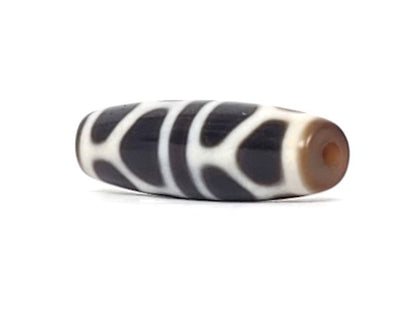 V-090924-DLBS Double Longevity dzi bead, angled end view, warm brown end tip and drill hole visible, unretouched