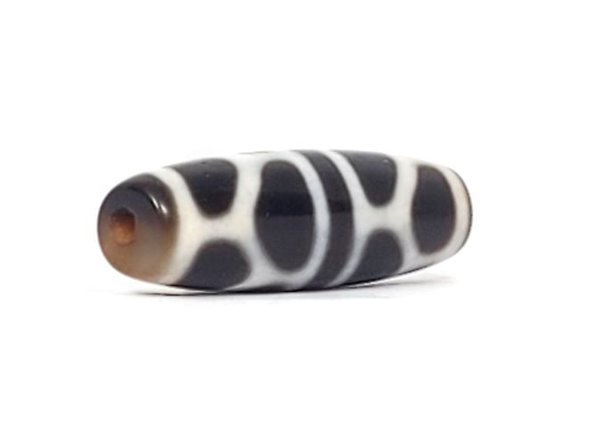 V-090924-DLBS Double Longevity dzi bead, opposite angled end view, warm brown cap, pitch-black body, unretouched