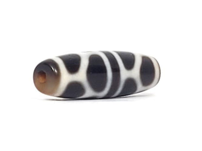 V-090924-DLBS Double Longevity dzi bead, opposite angled end view, warm brown cap, pitch-black body, unretouched