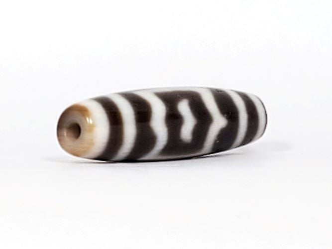 V-091424-GarudaBS Garuda dzi bead, opposite end view, honey-tan cap, very deep dark brown body, unretouched