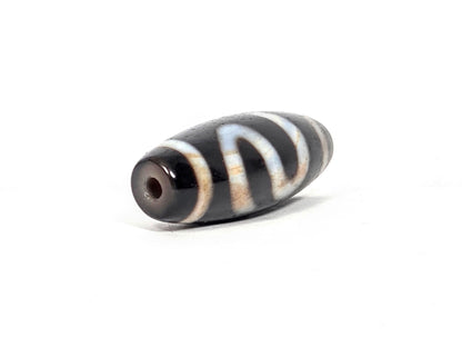 Vintage Money Hook Motif Dzi Bead with white striped agate patterning and natural patina