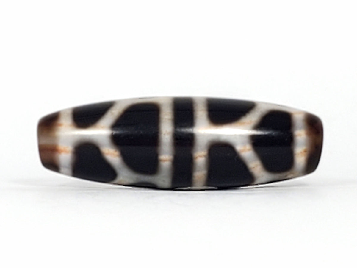 Double longevity dzi bead, pitch-black agate, white grid pattern, bloodspot patina, oval barrel shape, 38.6mm