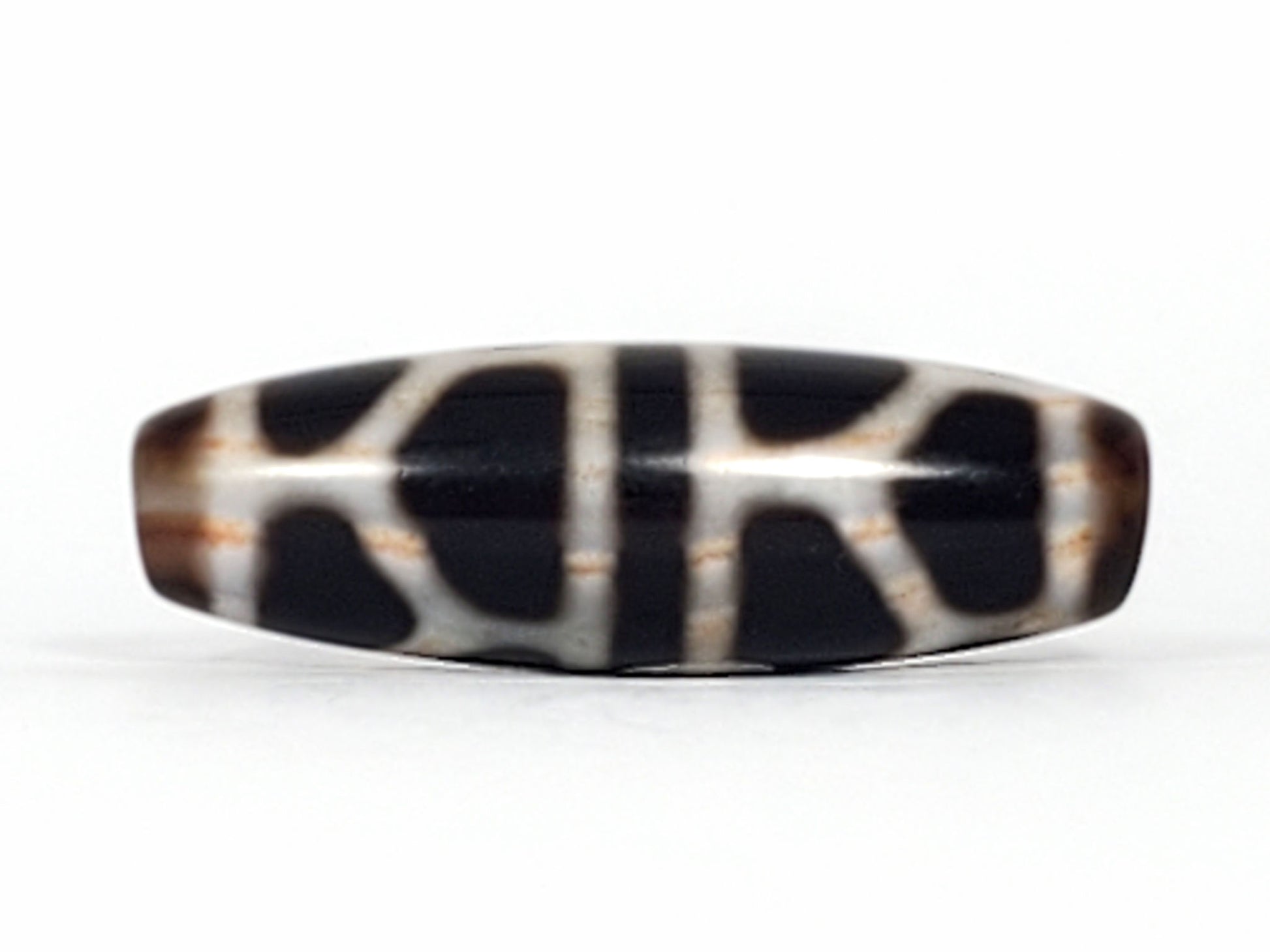 V-092824-DLBS2 Double Longevity dzi bead, third face angle, minor surface mark visible in lower cream zone, unretouched