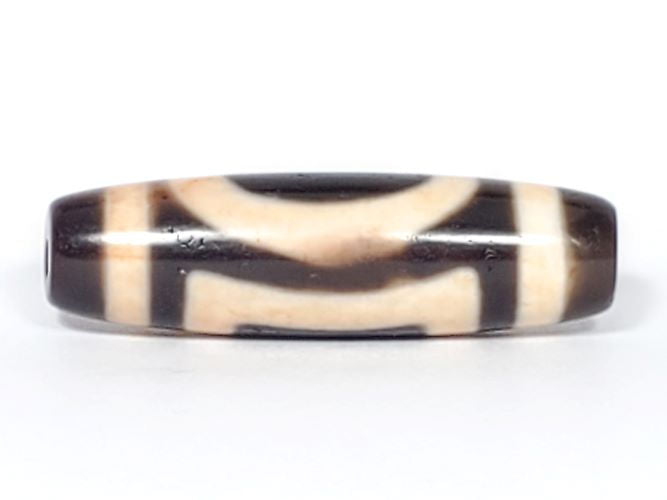 V-082123-HEBS Heaven & Earth dzi bead, opposite angled end view, chestnut-brown cap, dark brown body, Heaven circle face, unretouched