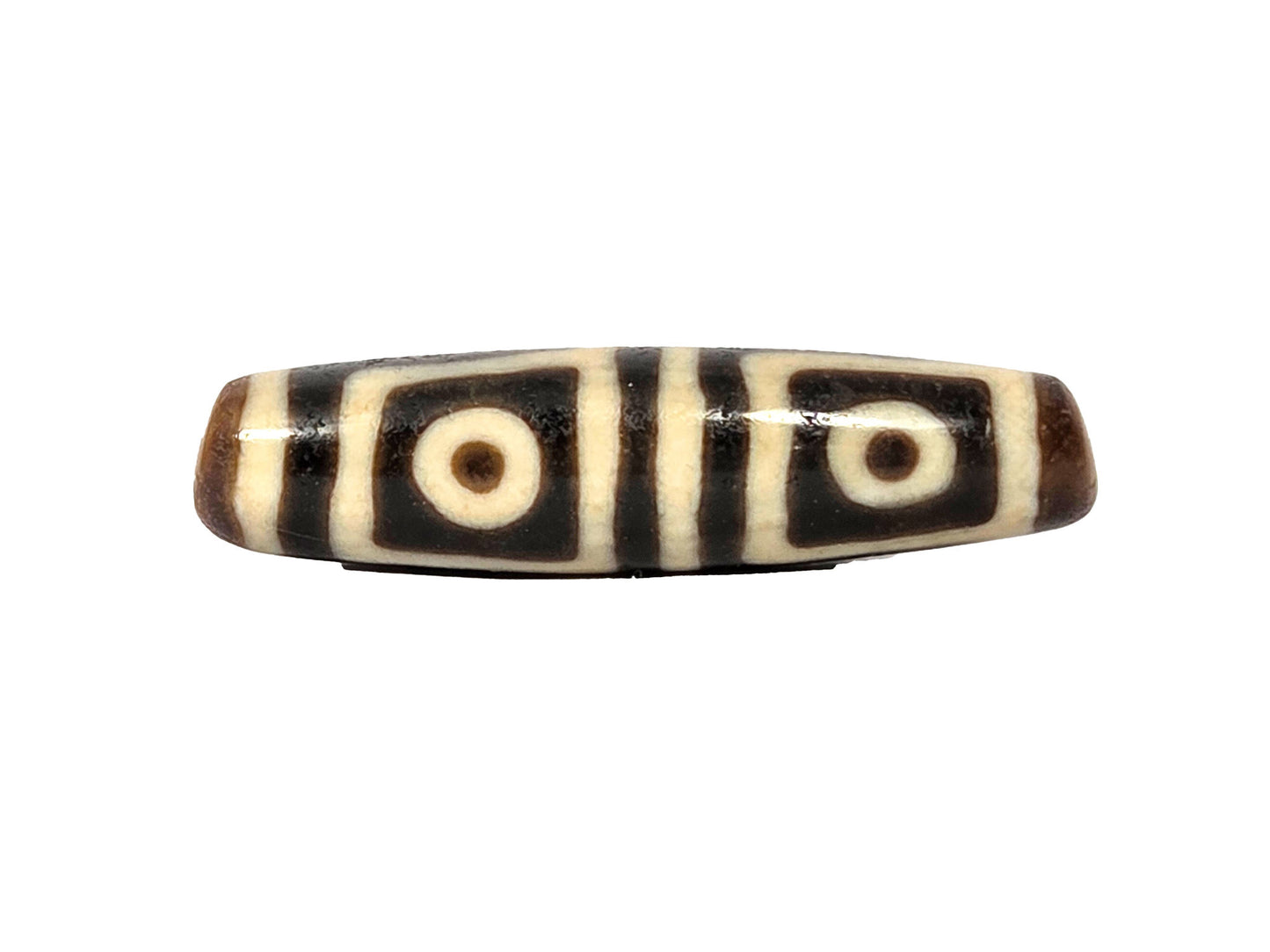 Ac-080425-4E ancient four eye dzi 49.5×12.6mm Face A, two square-framed eyes on deep dark warm brown ground, unretouched