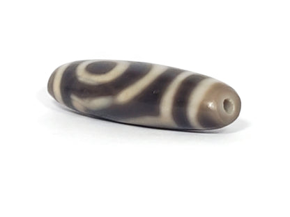 Ac-071026-TWE3 ancient two eye dzi angled view drill end A oval cross-section profile small hole unretouched