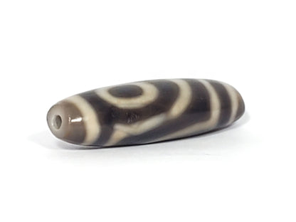 Ac-071026-TWE3 ancient two eye dzi angled view drill end B charcoal grey-brown end cap unretouched