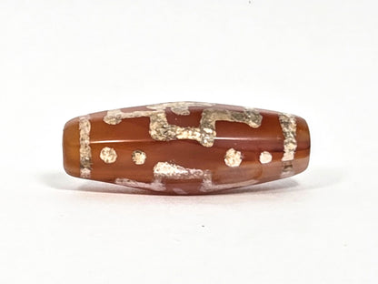 Ac-080426-DCCS ancient carnelian dzi bead 29.1×12.2mm, Face B showing partial cross motif and star dots lower register, unretouched